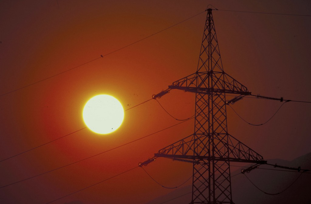 Sunset and electric pylons. Austria