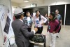 Visitantes conhecem fantoche eletrônico para crianças autistas no estande da Fapeam