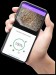 Mão segurando celular com a app Woodscan- Foto Arquivo da empresa Woodscan